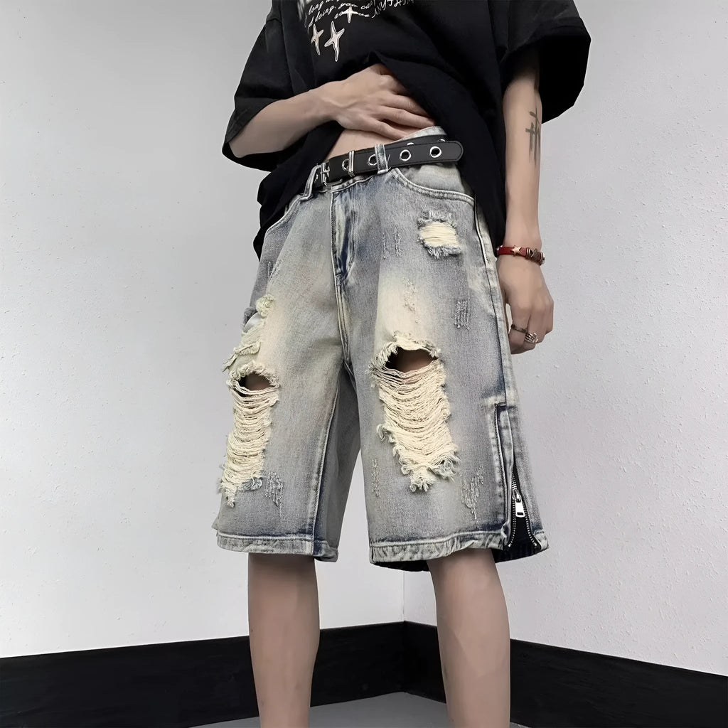 Blue wide-leg denim shorts with tattered retro styling and loose fit design