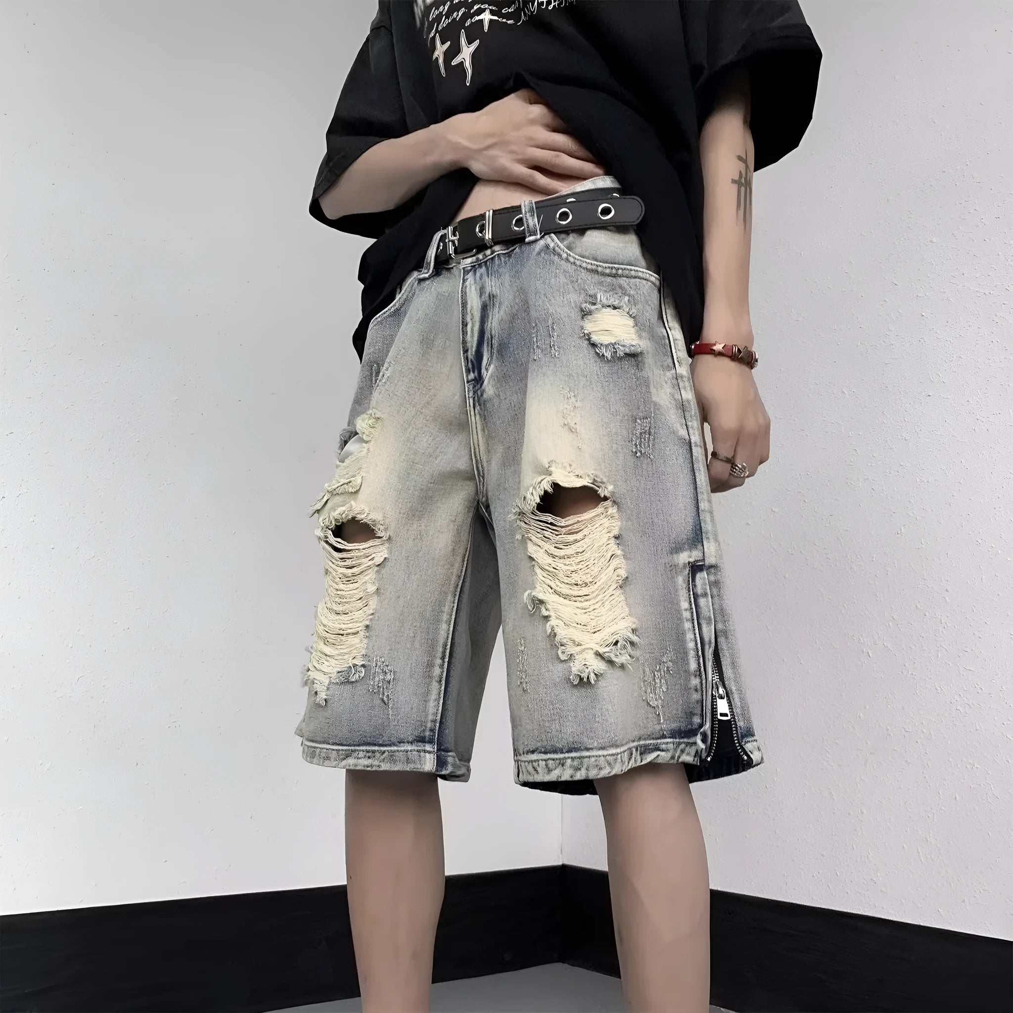 Blue wide-leg denim shorts with tattered retro styling and loose fit design