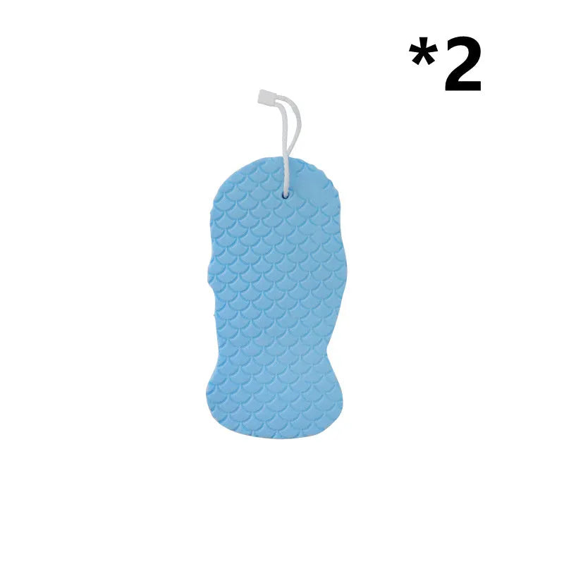 White 3D fish scale pattern bath sponge ball on a bathroom surface