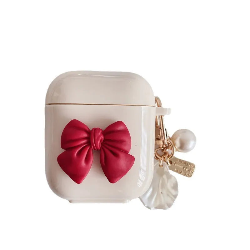Beige red bow shell TPU AirPods protective case showing clamshell design