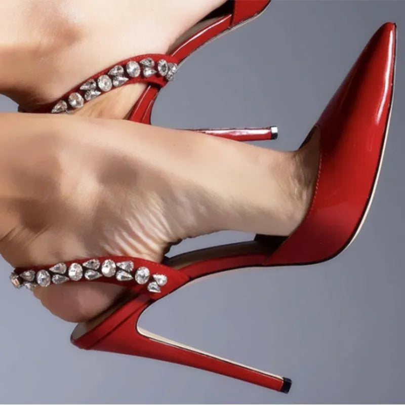 Pointed toe high heel sandals with rhinestone decoration on the side, in patent leather.