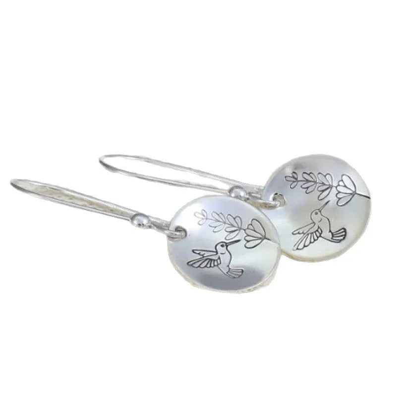 Silver zinc alloy earrings with glossy bird motif and floral leaf design