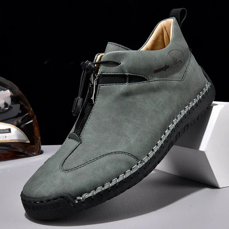 Men's casual leather shoe in green with a tall crown, round toe, mid heel, and rubber sole.