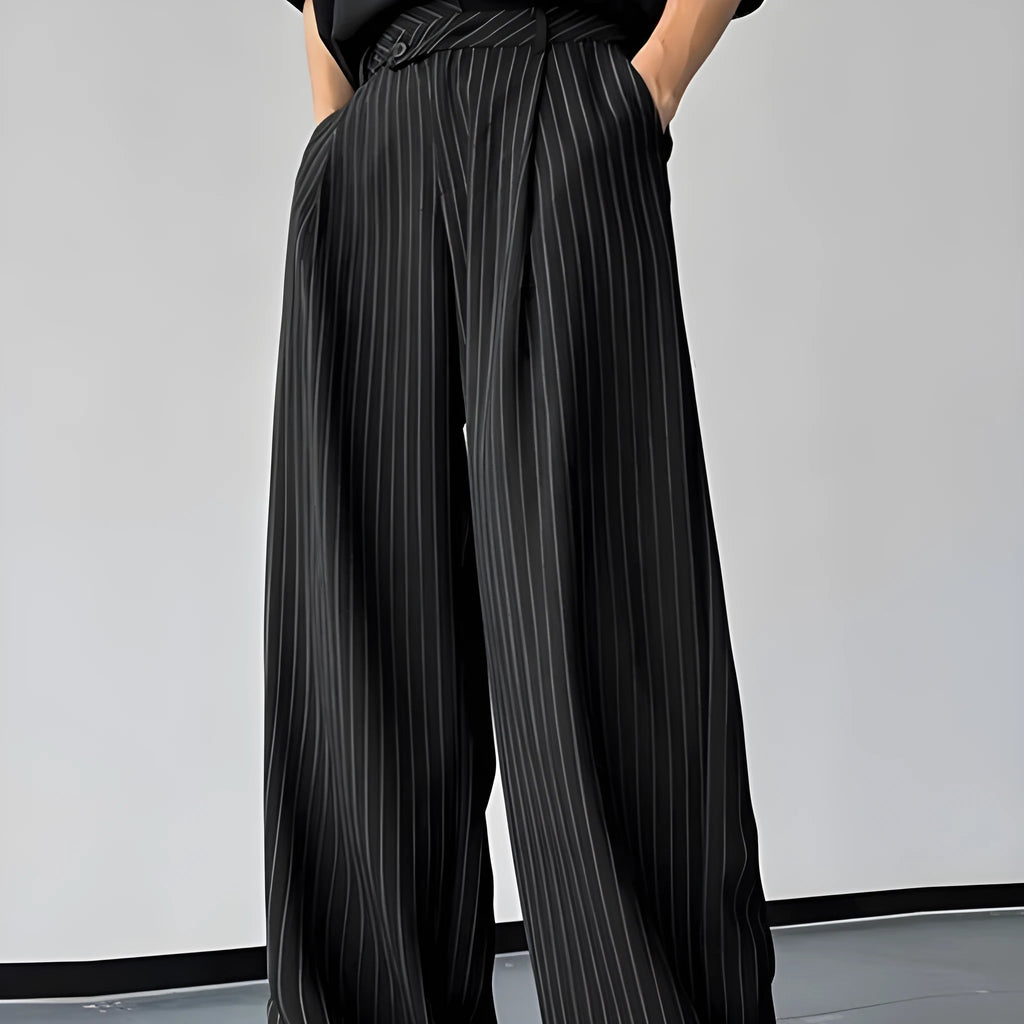 Black men's trousers with vertical stripes and pleats, made from an elastic rabbit hair and bamboo fibre blend.