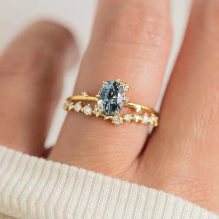 Gold plated flower ring with green zircon stones on display
