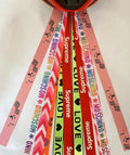 A decorative streamer ribbon accessory for attaching to a child's roller skating, ski, or balancing car helmet.
