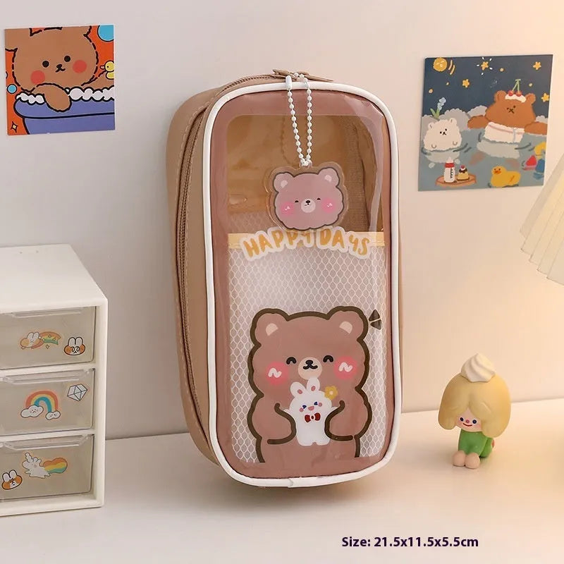 Transparent PVC pencil case with cartoon pattern, showing large capacity design for stationery storage