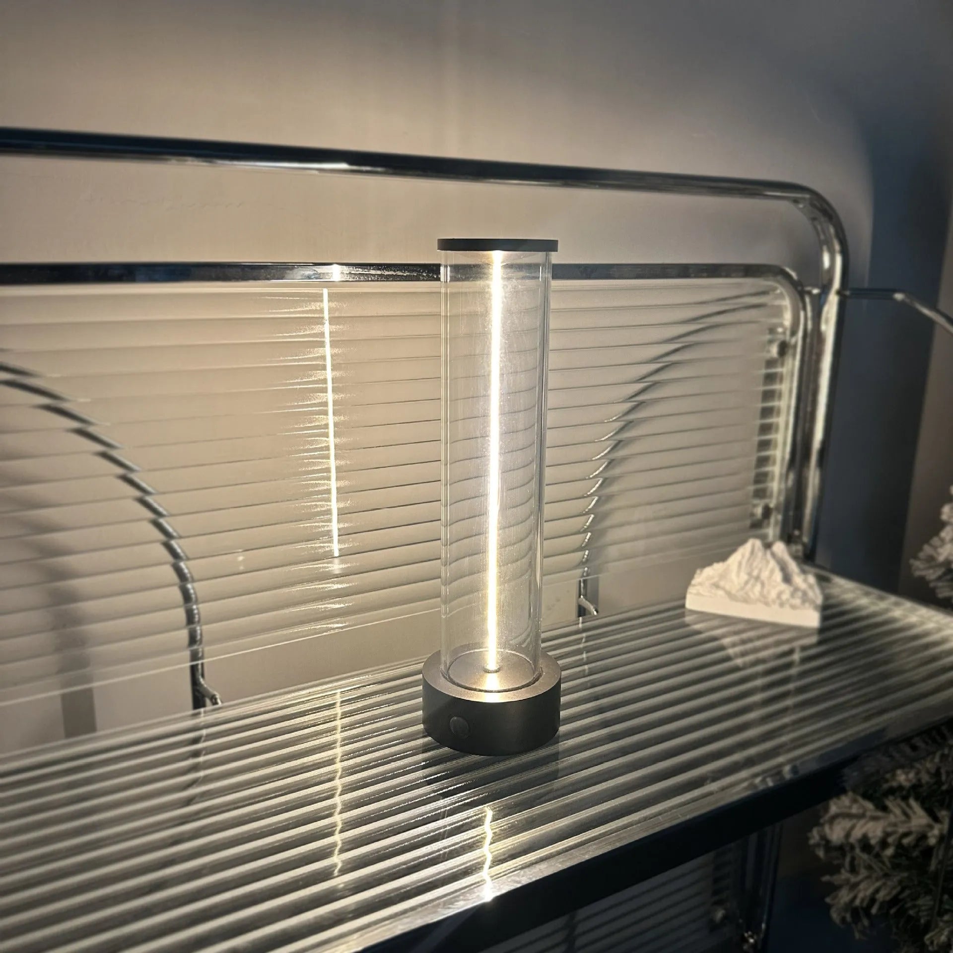 Grey modern LED line glass light strip with magnetic suction base for USB charging.