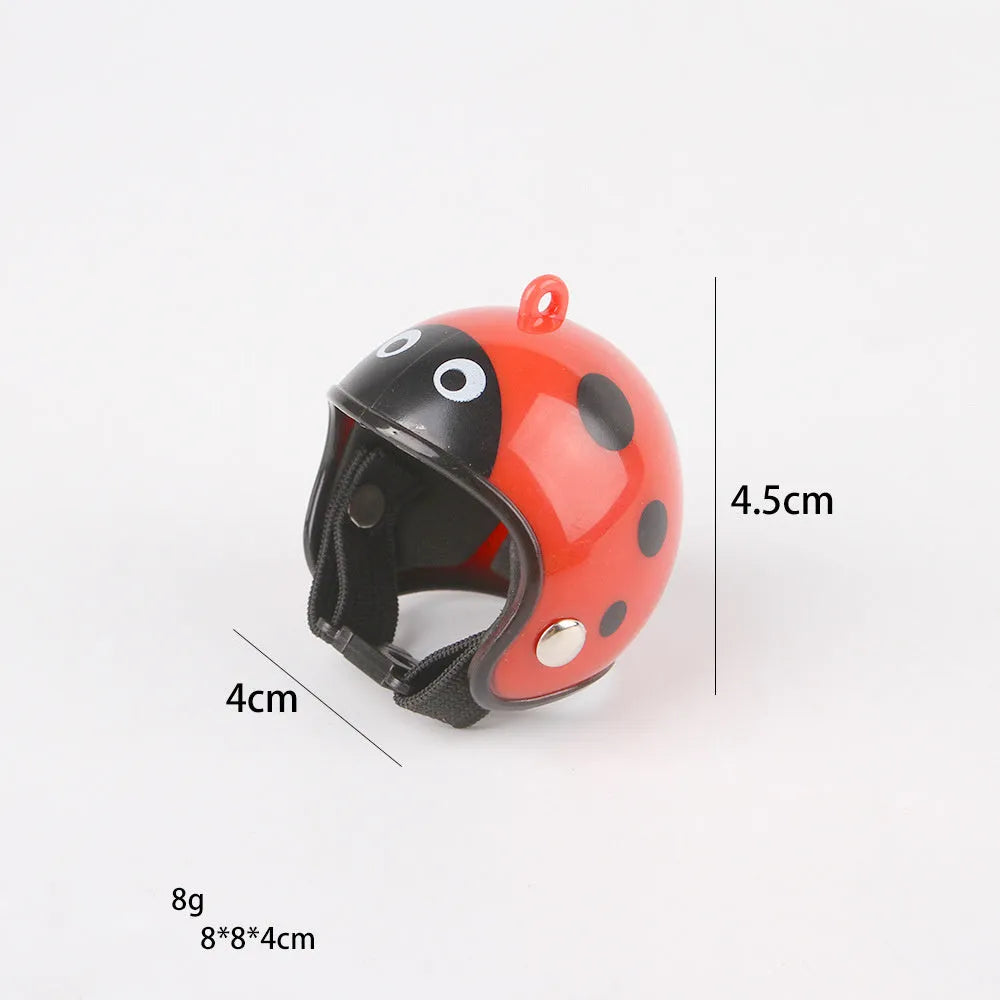 Small hard plastic helmet with elastic straps and sponge lining for a chicken or pet bird.