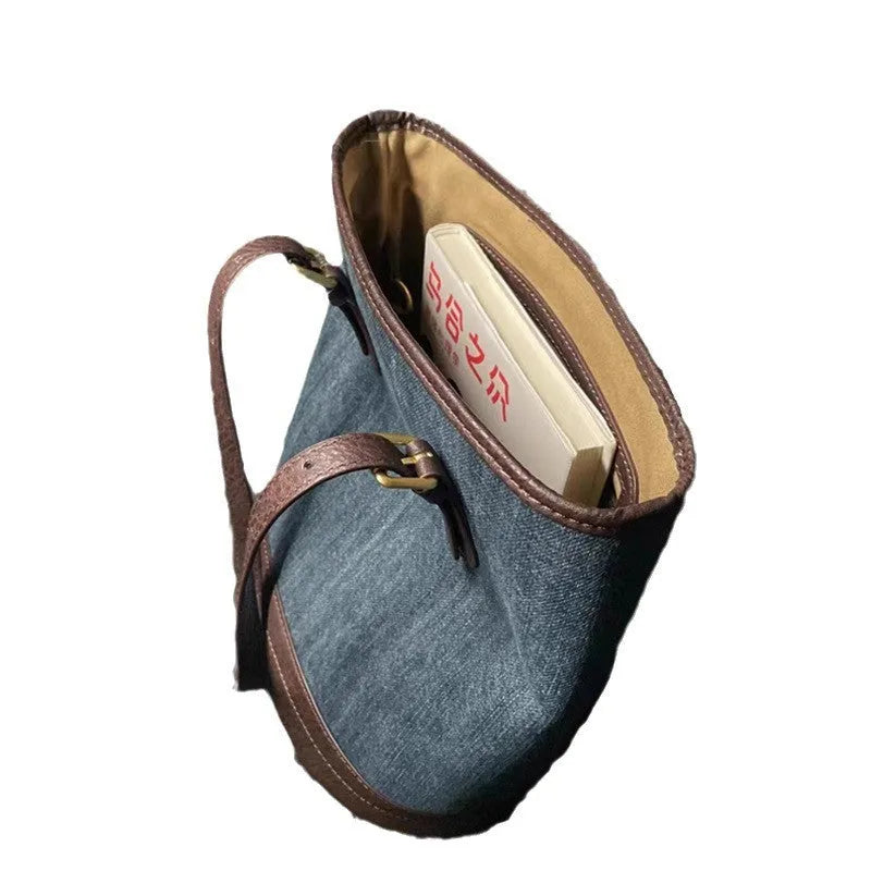Denim patchwork one-shoulder bucket handbag with polyester construction measuring 23cm by 27cm by 16cm