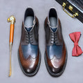 Mens curry blue leather brogue boots with colour blocking and carved design on a low square heel.