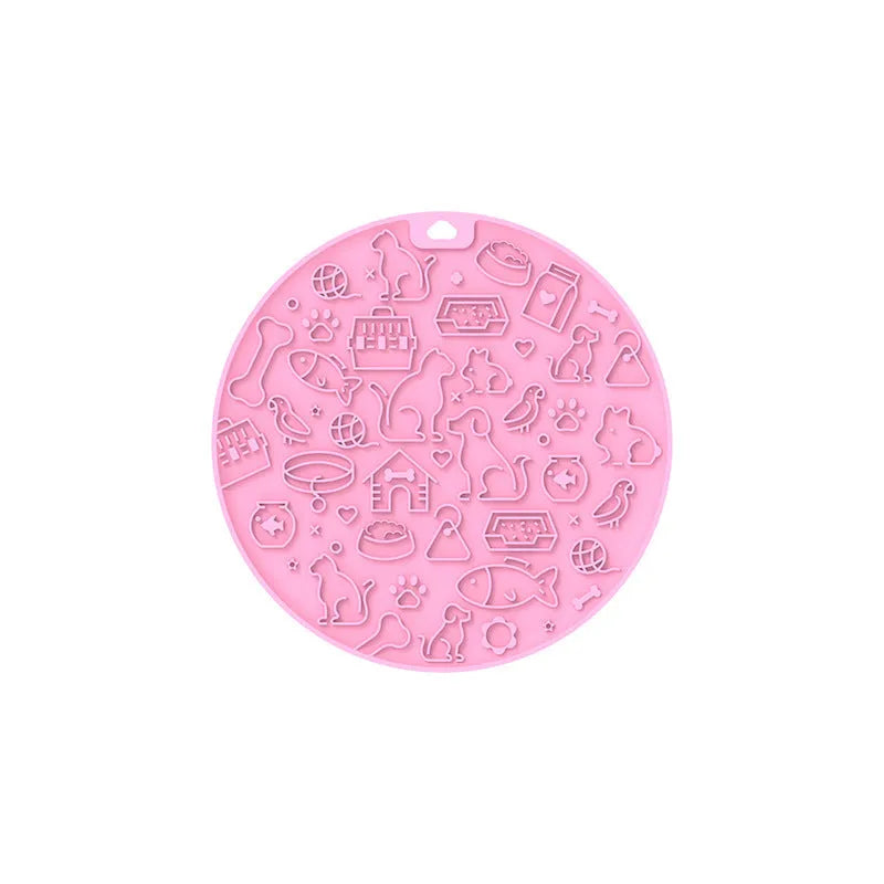 Round blue silicone pet lick mat with suction cup base on a kitchen counter