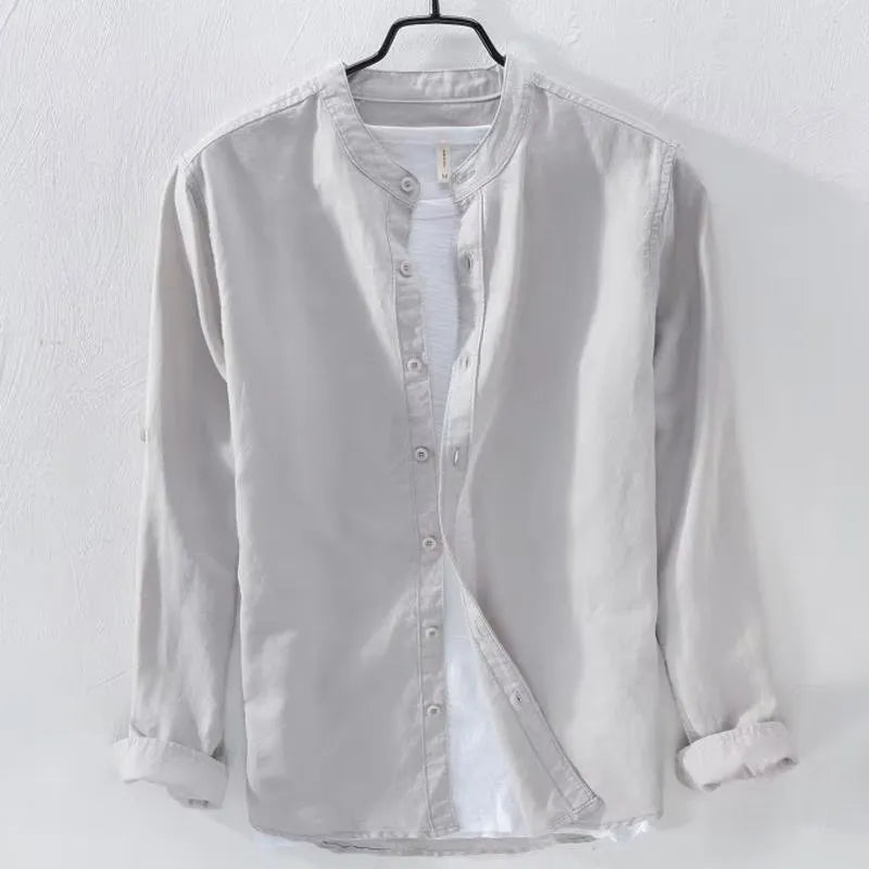 Loose fit long sleeve cotton linen shirt in solid dark blue colour displayed flat showing casual style