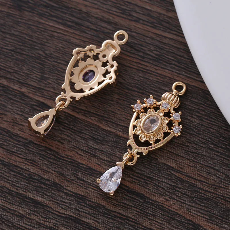 Water drop pendant with micro inlaid zirconia in five colour options showing 12mm x 23mm dimensions