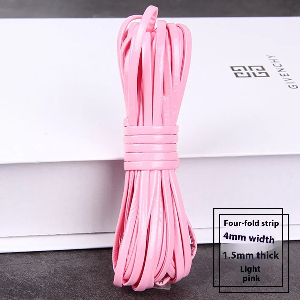 Coils of PU leather craft cord in multiple colours including black, red, blue, and beige