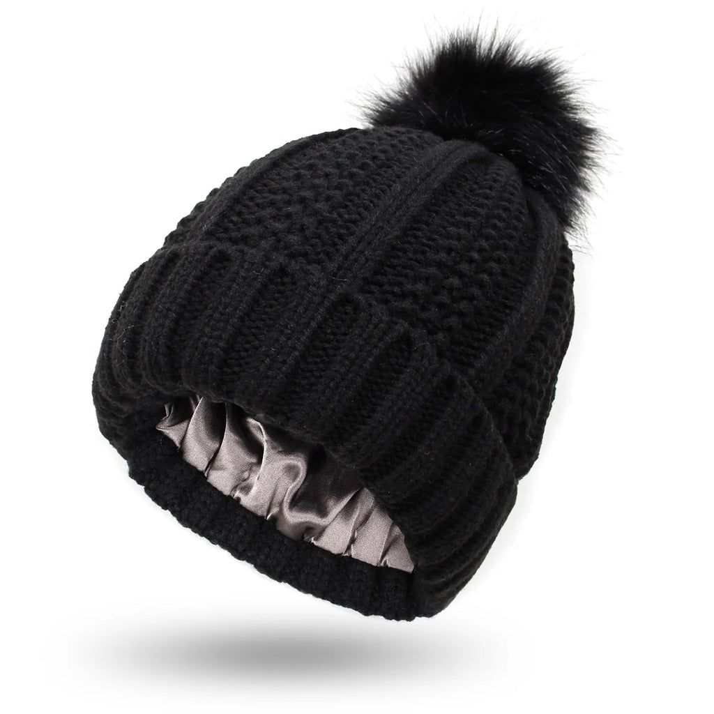 Women's wool beanie hat with satin lining and faux fur pom pom in multiple colours