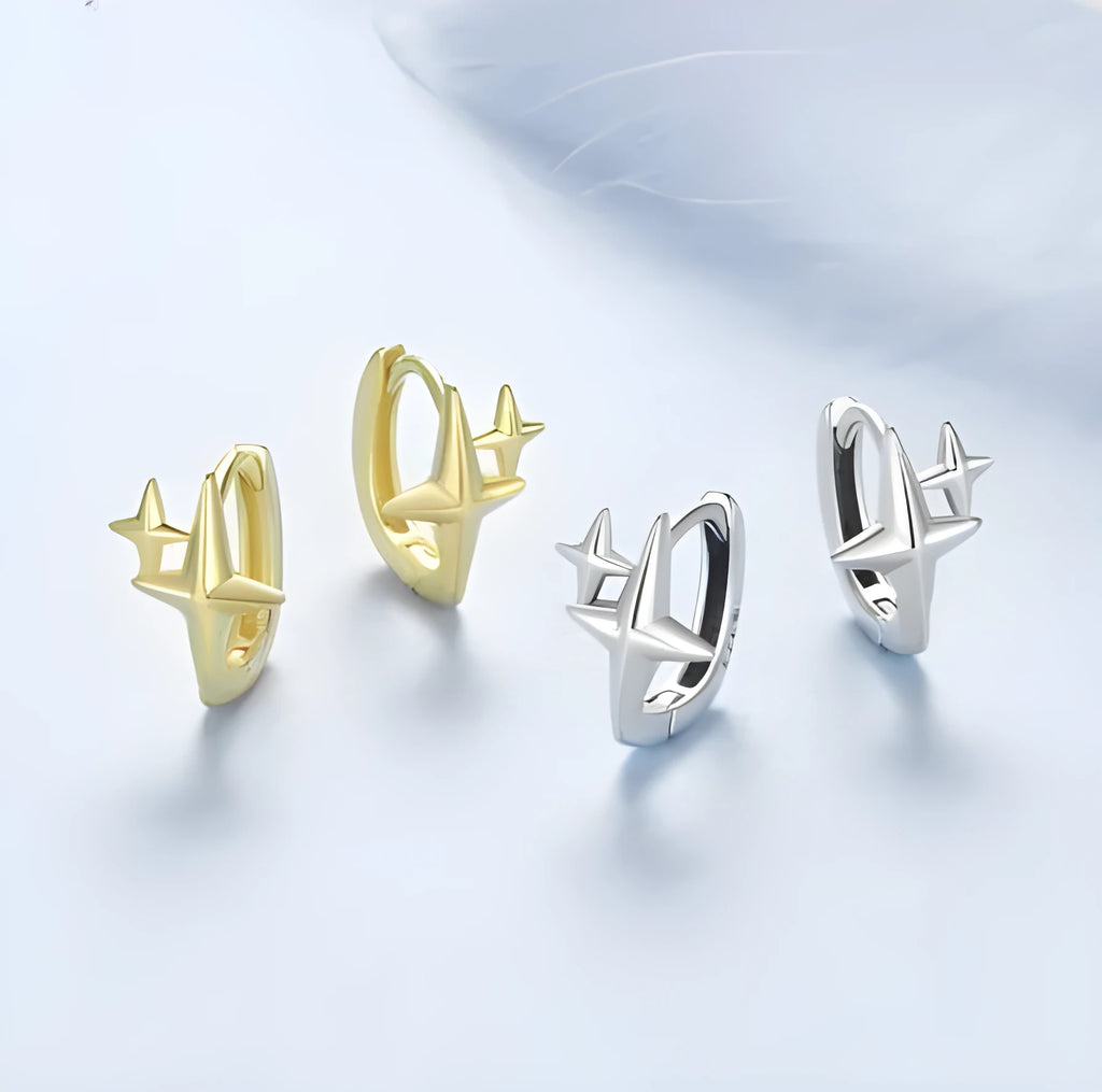 Sterling silver minimalist star design clip-on earrings with XINGX detail and oxidation finish.