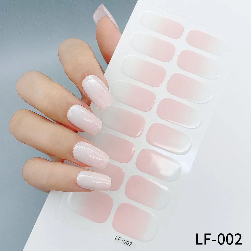 Set of 16 solid colour nail art stickers showing floral, geometric, and pattern designs for manicure application