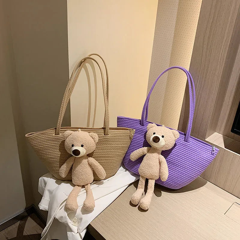 Cotton and linen woven shoulder bag with dumpling shape and double straps in multiple colours