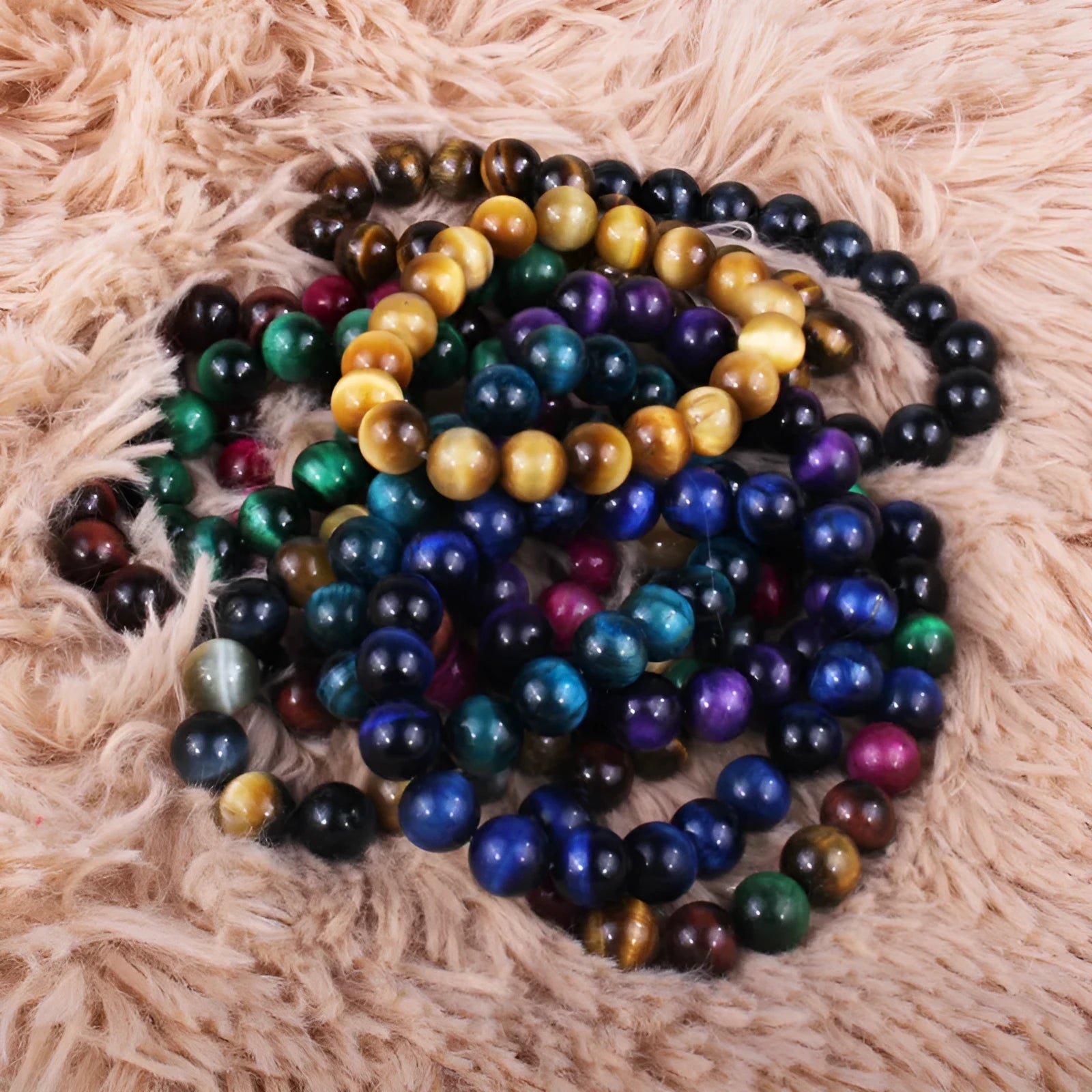 Natural tigereye crystal bracelet with geometric round beads showing colour and size options.