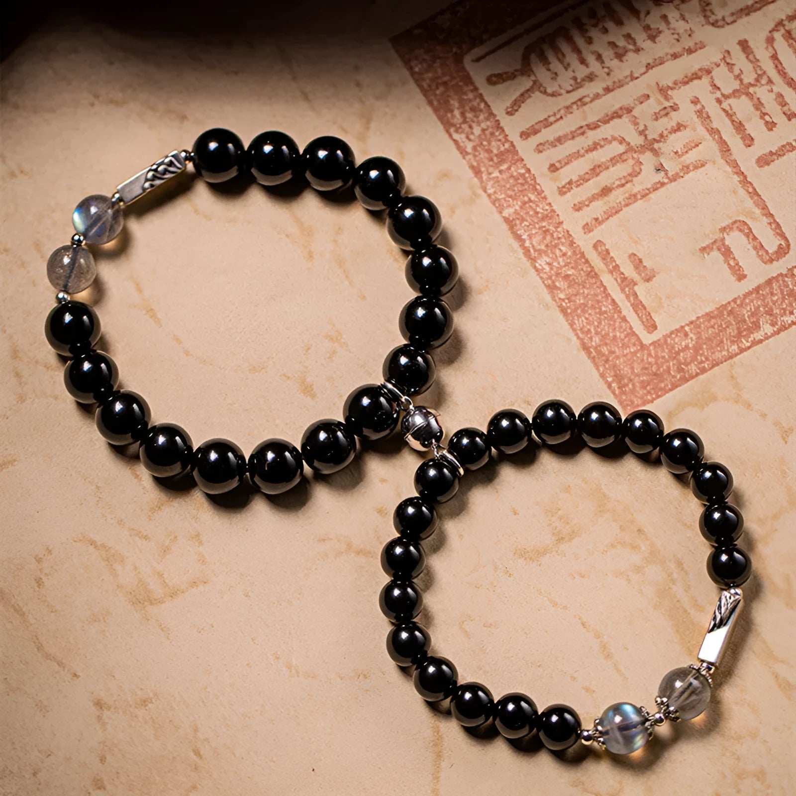 Obsidian Buddha beads couple bracelet DIY set showing 8mm women's and 10mm men's sizes