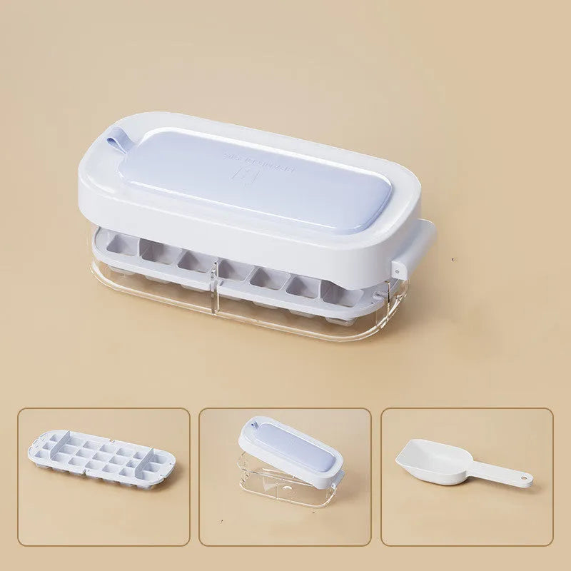Blue food-grade plastic ice cube tray with grid design and integrated ice shovel storage.