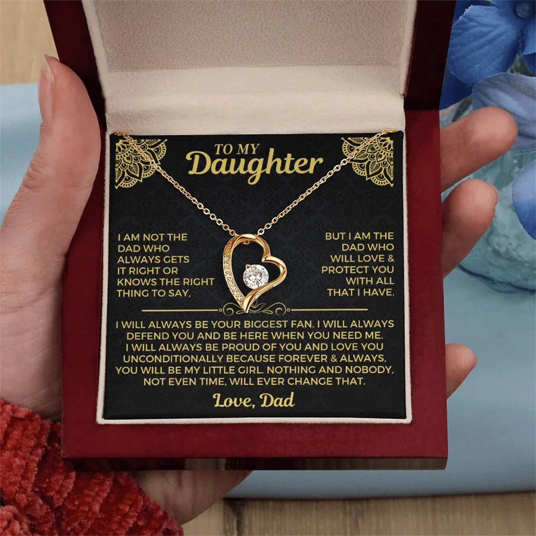 Gold hollow heart pendant necklace presented in an open flip gift box with a card.