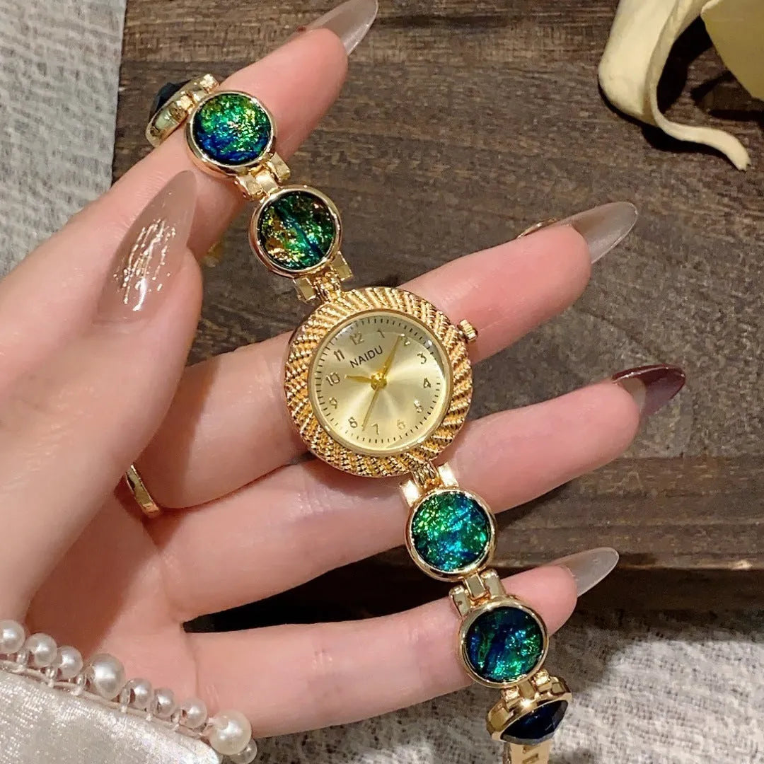 Women's quartz watch with 25mm round dial in one of six colours including milky white and dark green