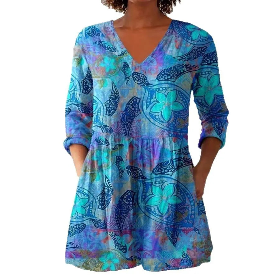 Women's slim-fit retro printed long-sleeved polyester top on a hanger, showing detail of digital print.