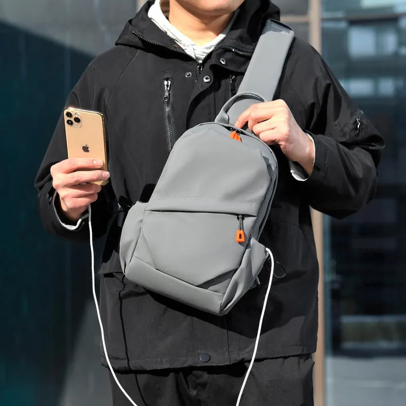 Men's black casual crossbody bag with a single shoulder strap made from polyester.