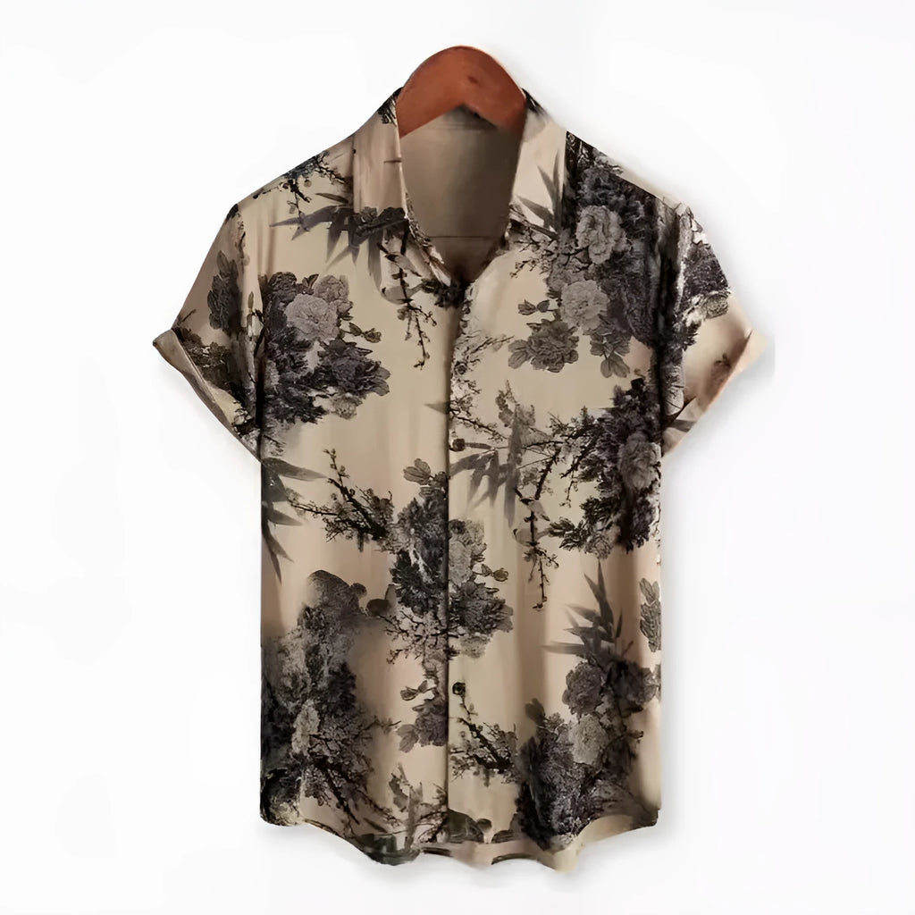 Man wearing a short sleeve Hawaiian floral print shirt with a lapel neckline, showcasing the digital print pattern.