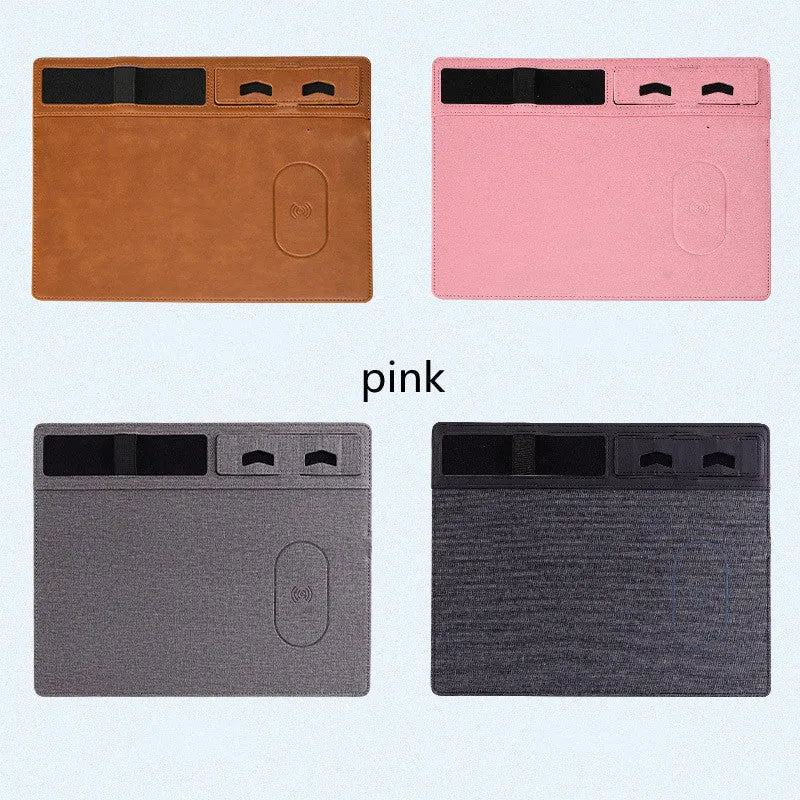 Pink wireless charging mouse pad with integrated phone holder on a desk, showing 320 x 260 mm size.