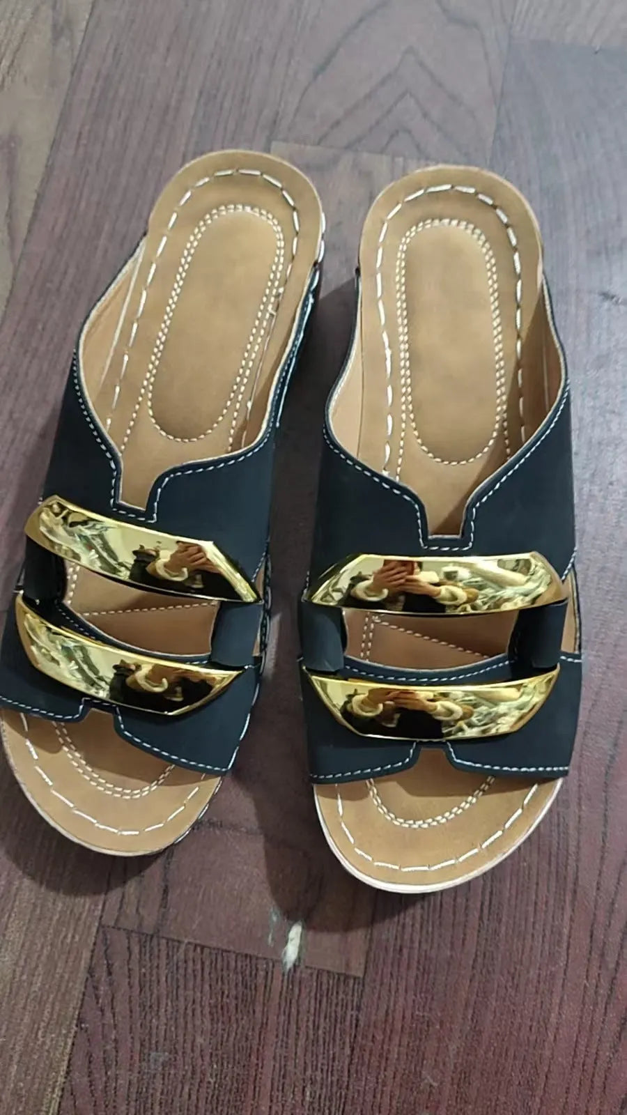 Roman style platform flip-flop sandals in white, black, khaki, and sea blue on a solid background