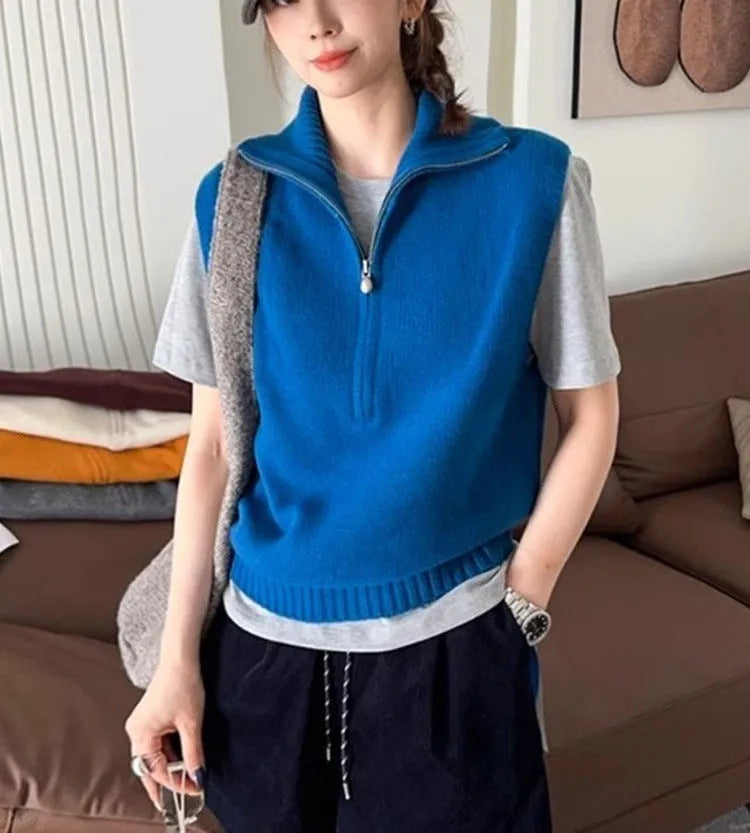 Retro half-zip sleeveless knit vest in mesh polyester fabric shown in a solid colour