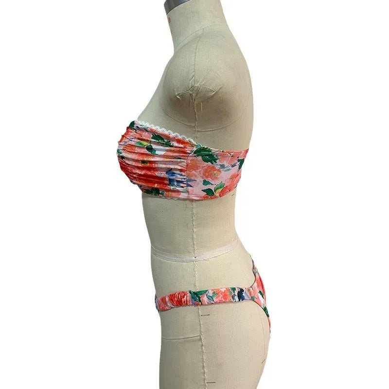 Women's tube top bikini set with lace trim in blue, yellow, pink, and floral print colours.