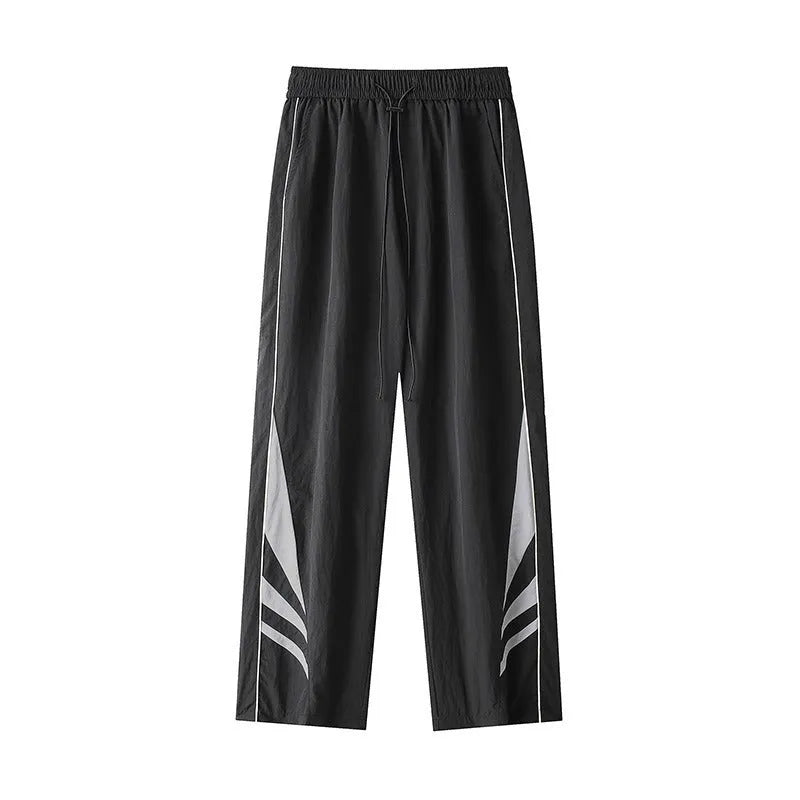 Black straight-leg loose-fit trousers on a plus-size male model for summer casual wear.