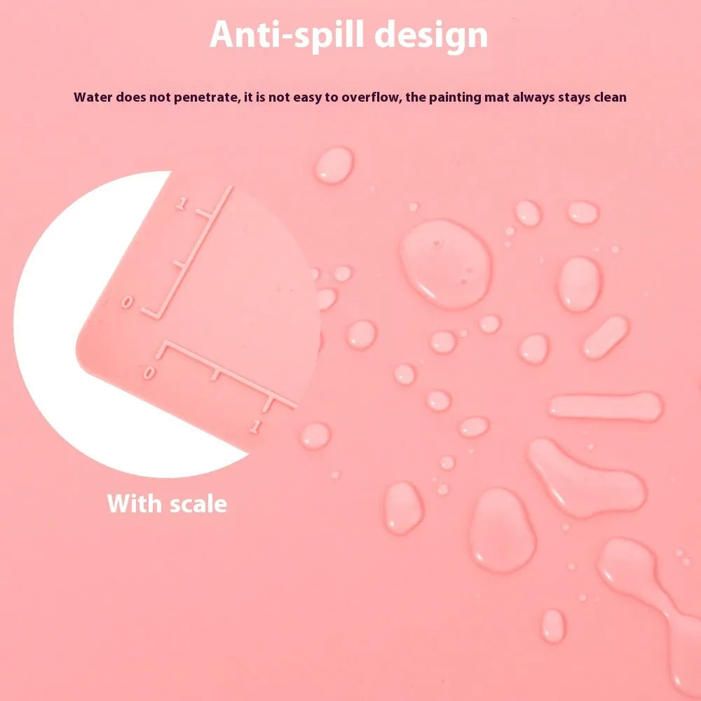 Light blue silicone painting mat with two round bowl compartments, measuring 50 by 40 cm.