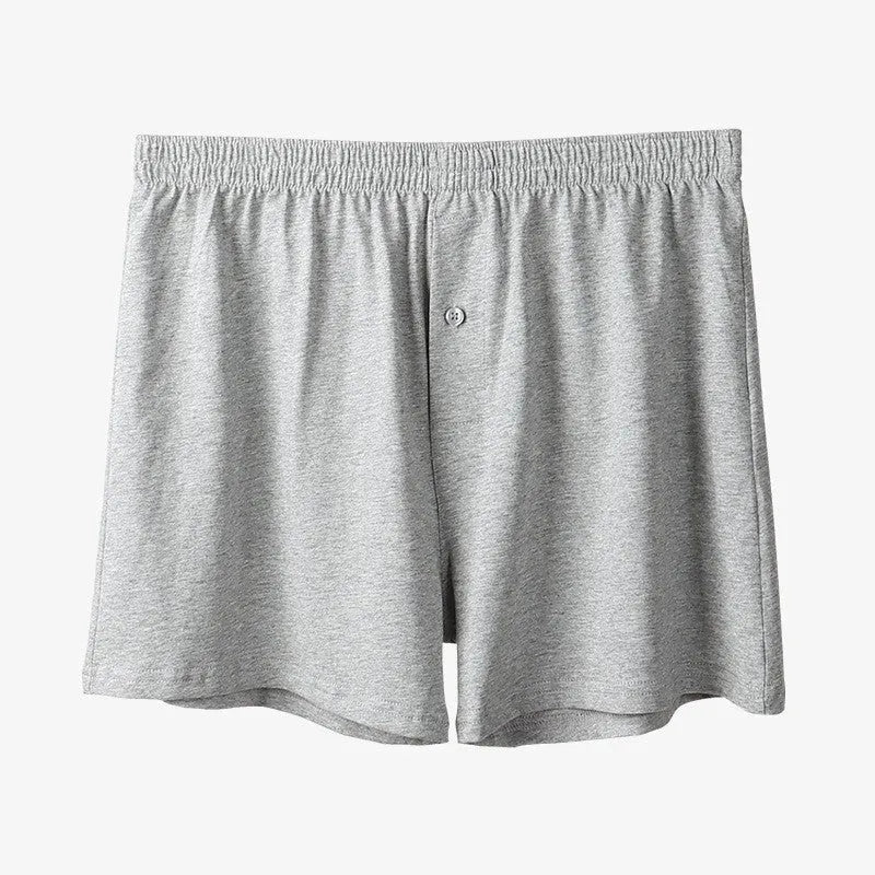 Men's high-waisted loose-fit cotton boxer shorts in black, grey, and navy blue.
