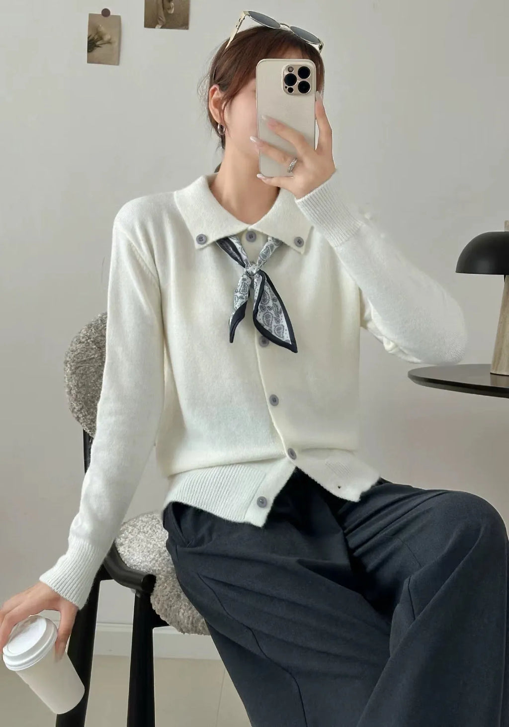 Beige lapel scarf collar acrylic cardigan with long sleeves on a hanger