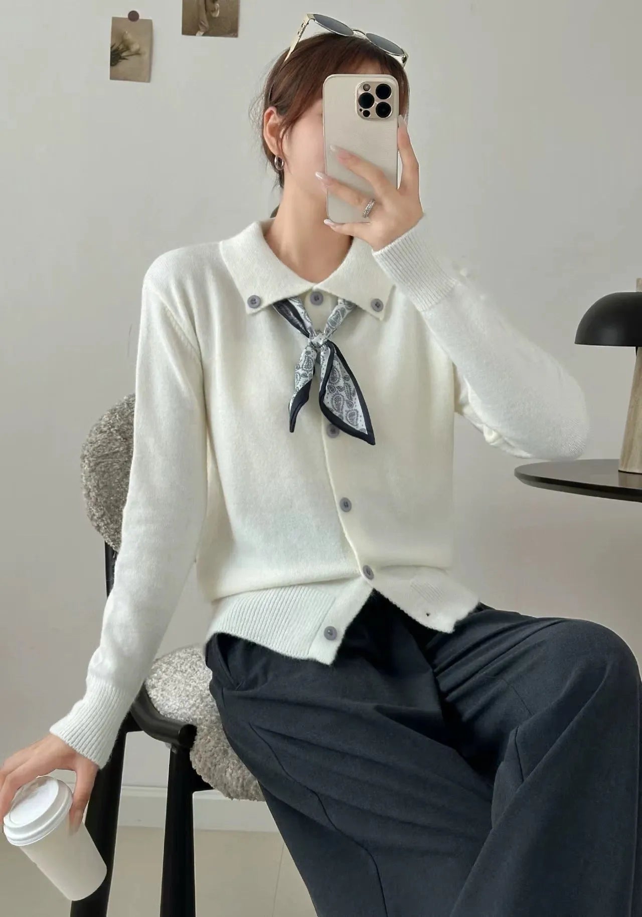 Beige lapel scarf collar acrylic cardigan with long sleeves on a hanger