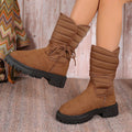 Women's black chunky heel snow boots with lace-up design and fleece lining.