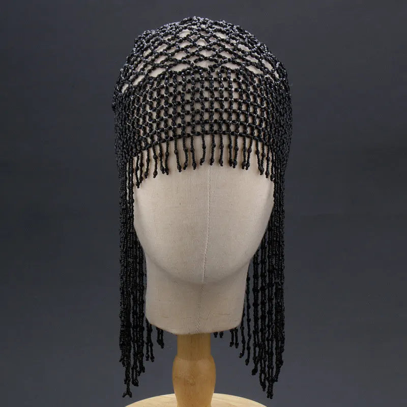Handmade silver belly dance hat with beaded alloy tile and long black tassels.
