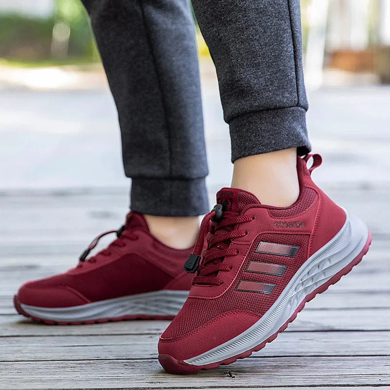 Men's and women's elastic band slip-on casual shoes in mesh material, showing colour options.