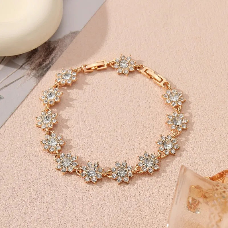 Gold and silver electroplated flower bracelet with coloured gemstone accents on zinc alloy