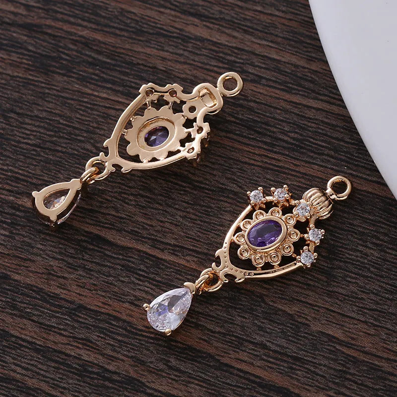 Water drop pendant with micro inlaid zirconia in five colour options showing 12mm x 23mm dimensions