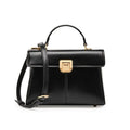 Women's black genuine leather shoulder bag with gold clasp closure showing interior compartments