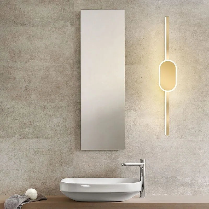 Modern wall-mounted bathroom mirror cabinet with integrated LED makeup lights around the edge.