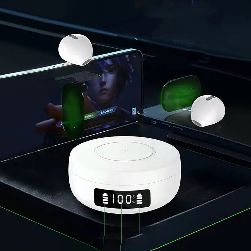 Mini black and white semi-in-ear wireless headphones with their charging case on a table.