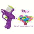 Green interactive cat toy launcher with foam disc for indoor pet play