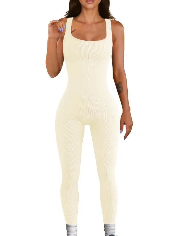 Women's beige suspender tank top tights with button detailing and long sleeves made from spandex fabric.